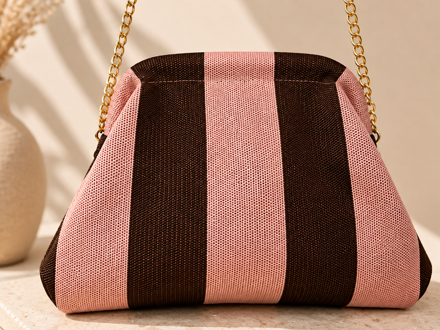 Bolso de rayas rosa y marrón